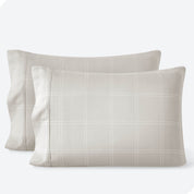 Two pillowcases on a white background with print pillowcases on them.
