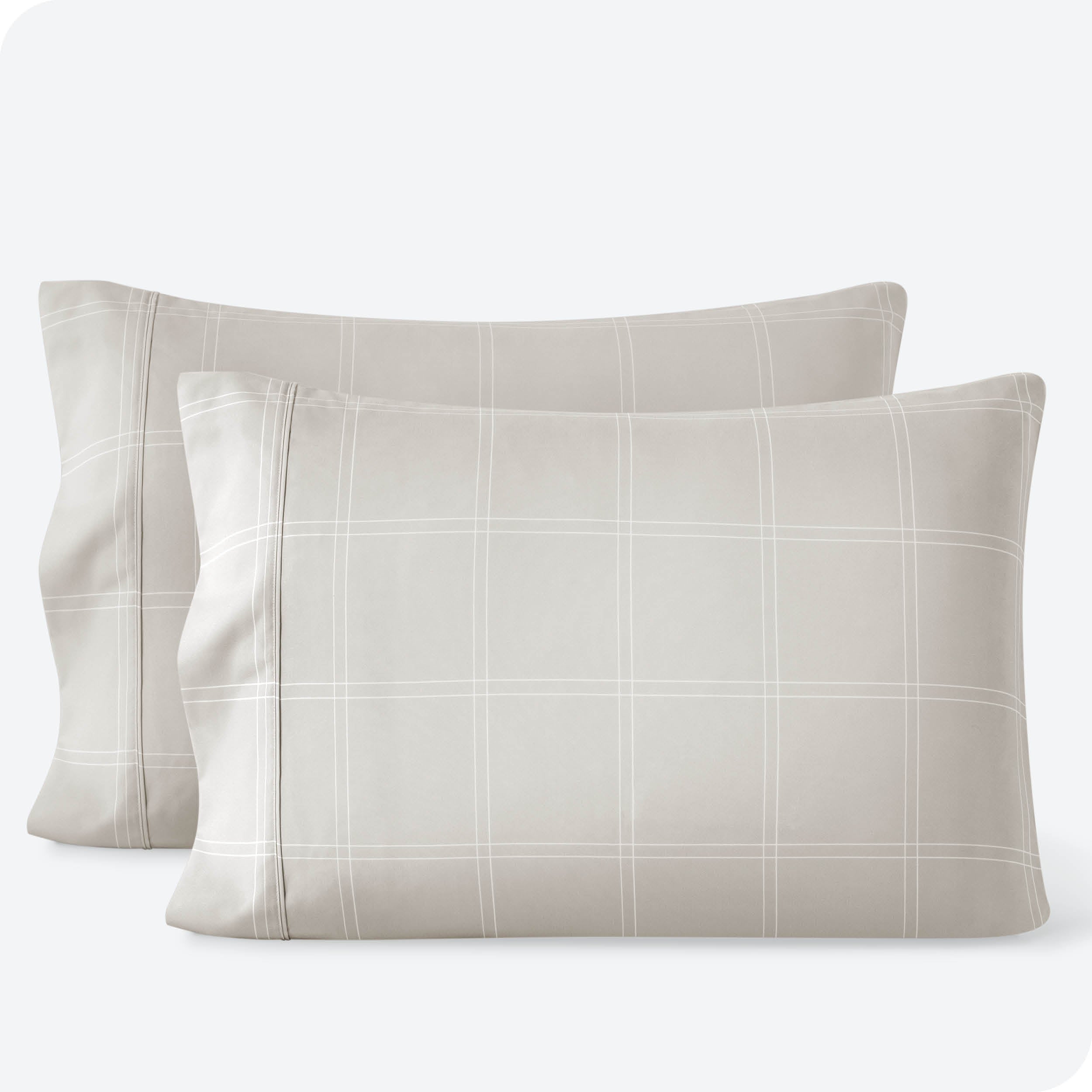 Two pillowcases on a white background with print pillowcases on them.