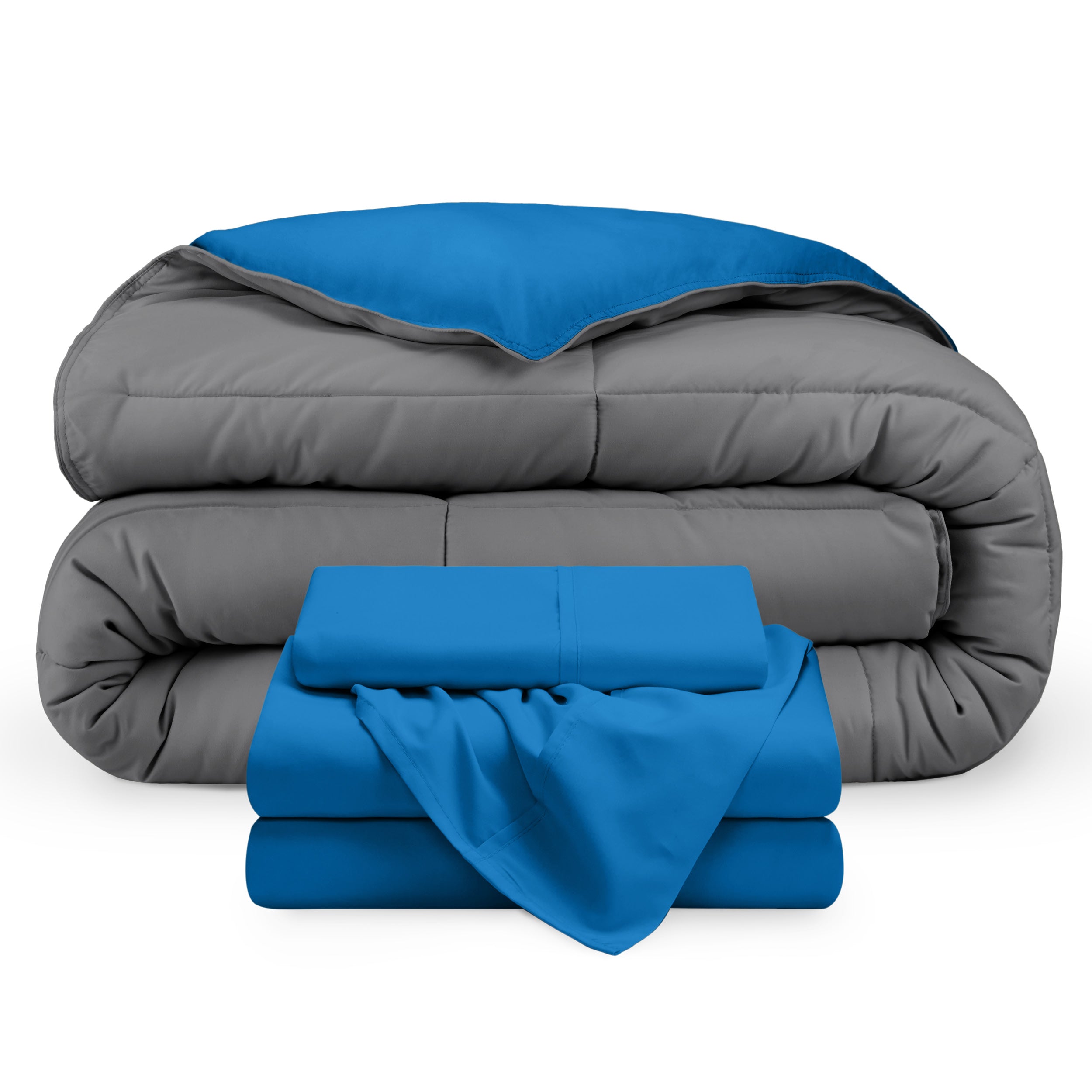 A reversible microfiber comforter and a coordinating sheet set folded and stacked 
