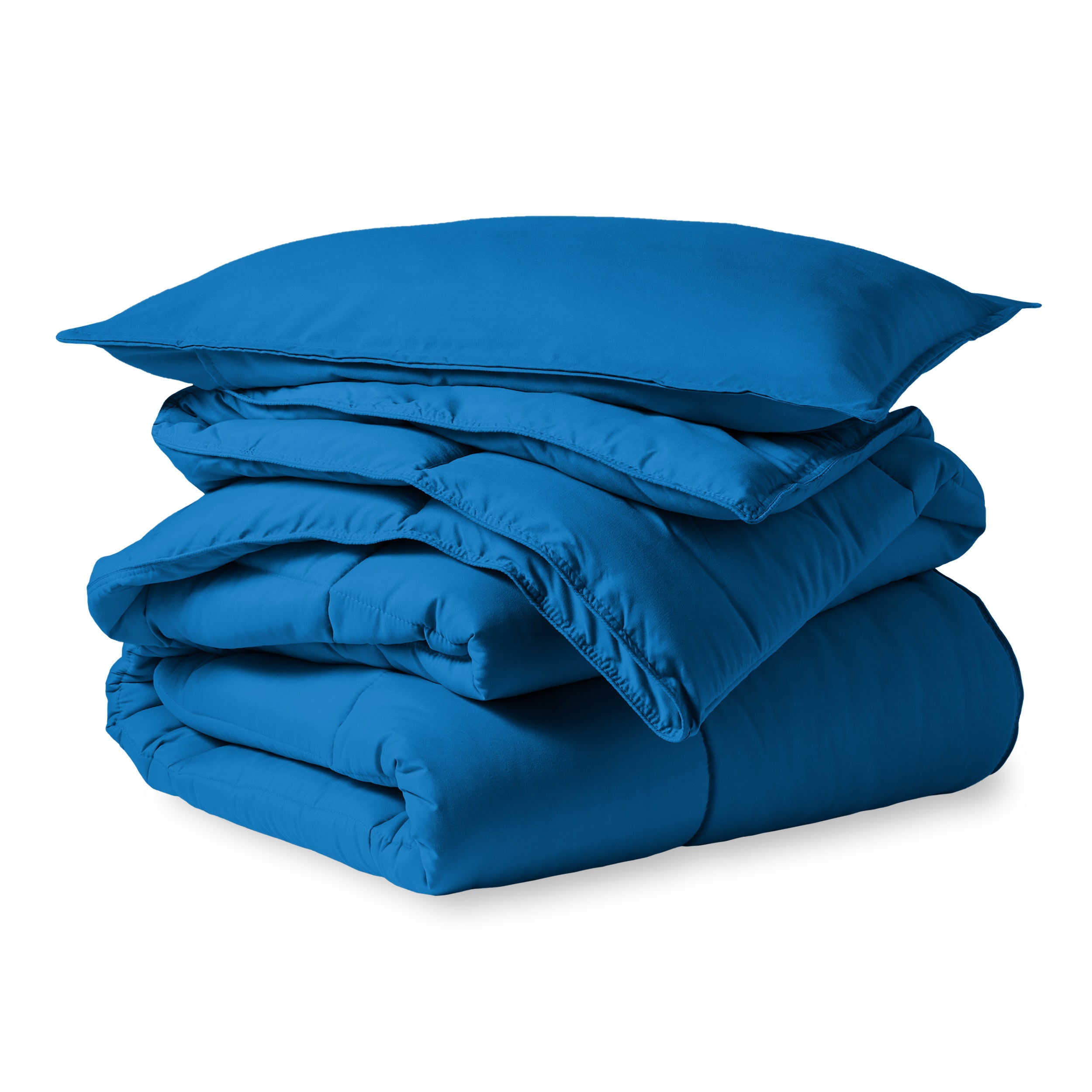 A microfiber comforter folded neatly with a pillow from above