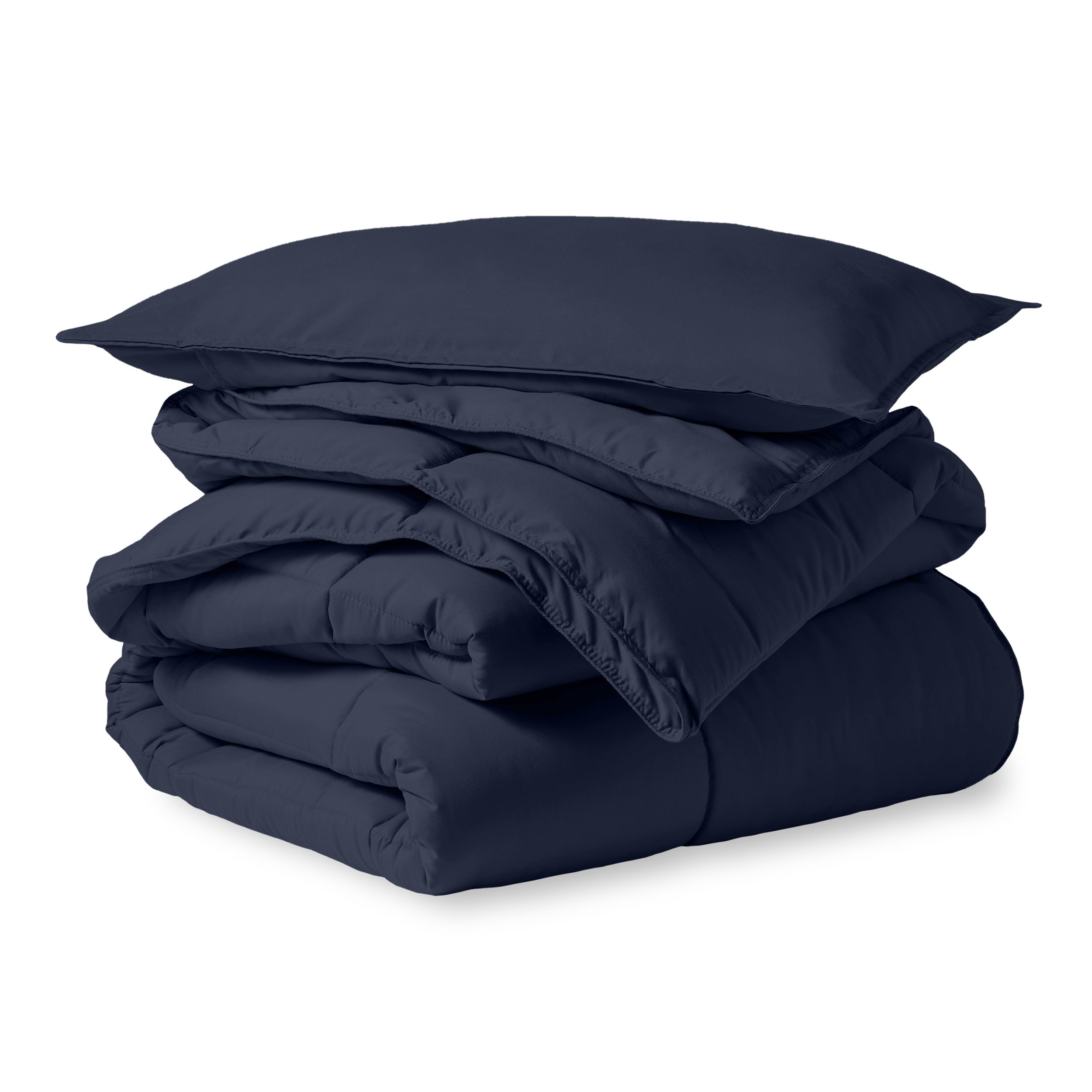 A microfiber comforter folded neatly with a pillow from above