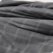 A close up of a track stitch comforter