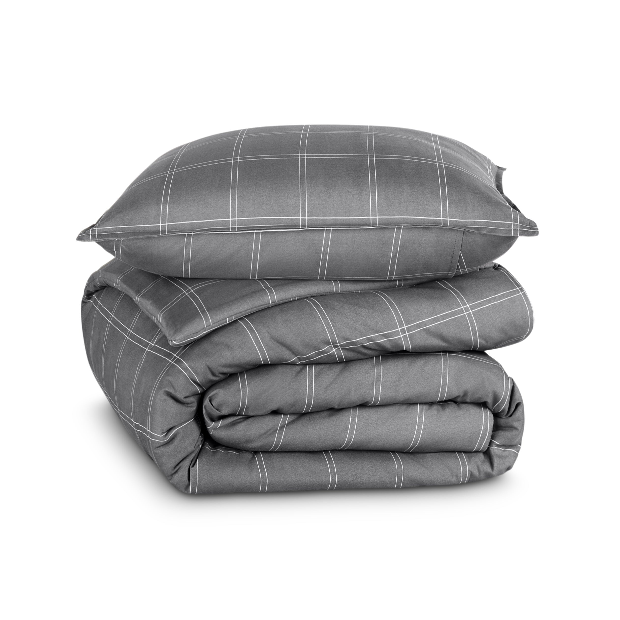 A comforter folded with a matching pillow sham stacked on top