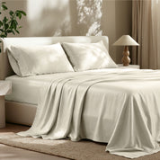 Tencel bed sheets and pillowcases on a bed in a bedroom setting.