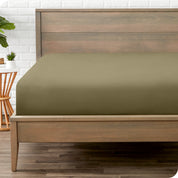 End of bed view with fitted sheet made on the mattress of a modern bed. 