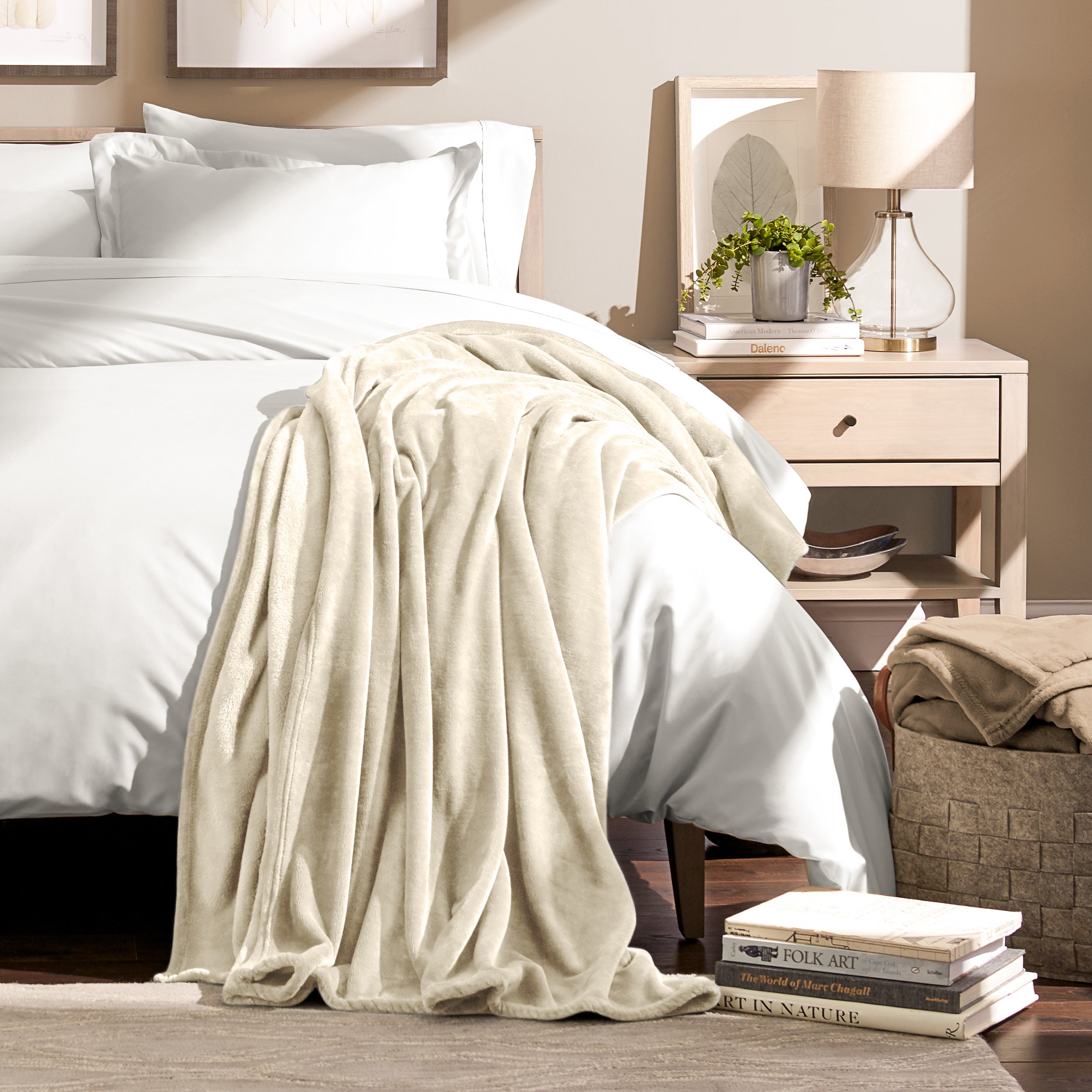 Microplush blanket laid out over a bed and folded back over itself
