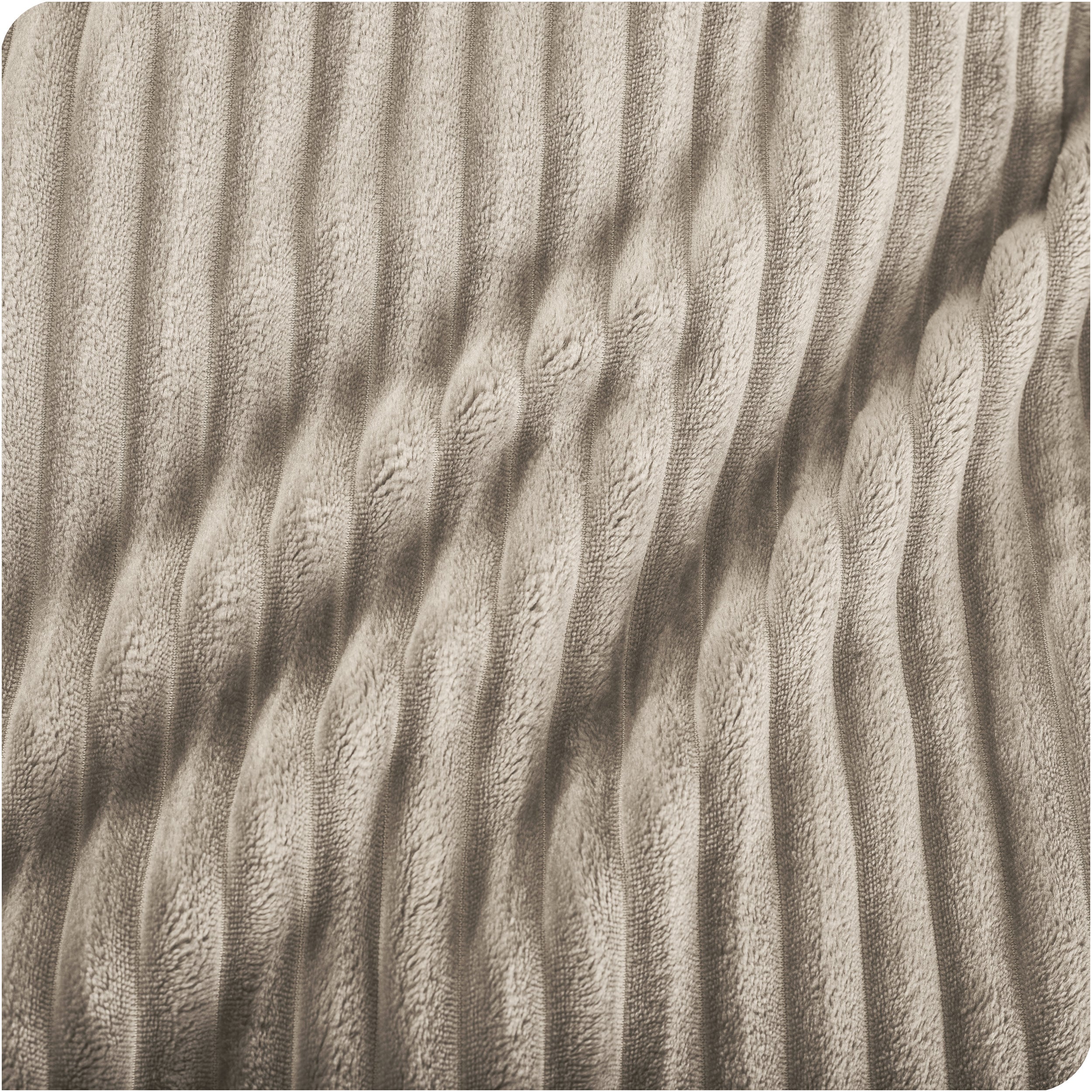 Close up of a ribbed microplush blanket showing the texture