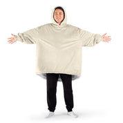 An adult with a sherpa wearable blanket on