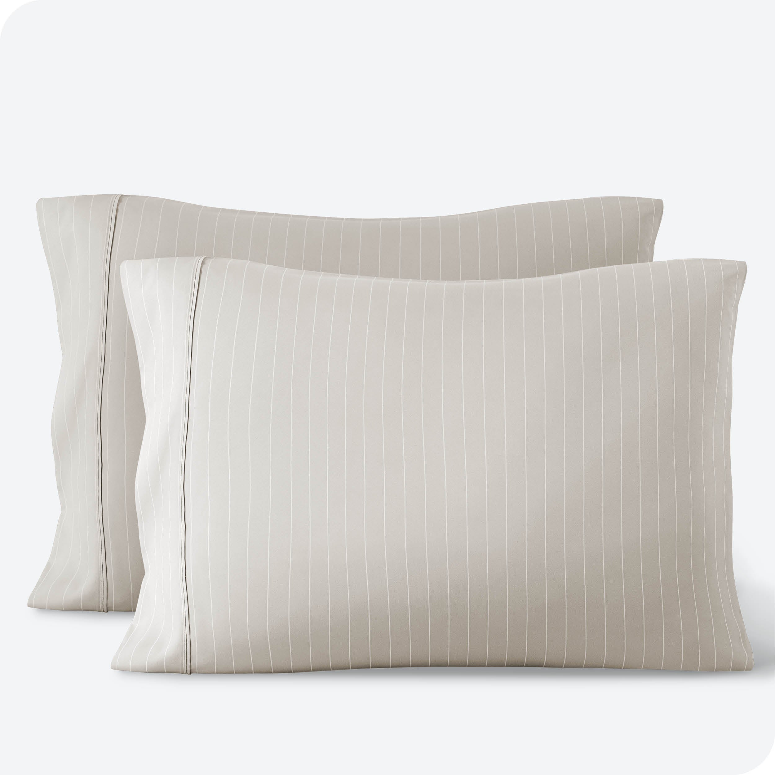 Two pillowcases on a white background with print pillowcases on them.