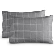 Two pillowcases on a white background with print pillowcases on them.