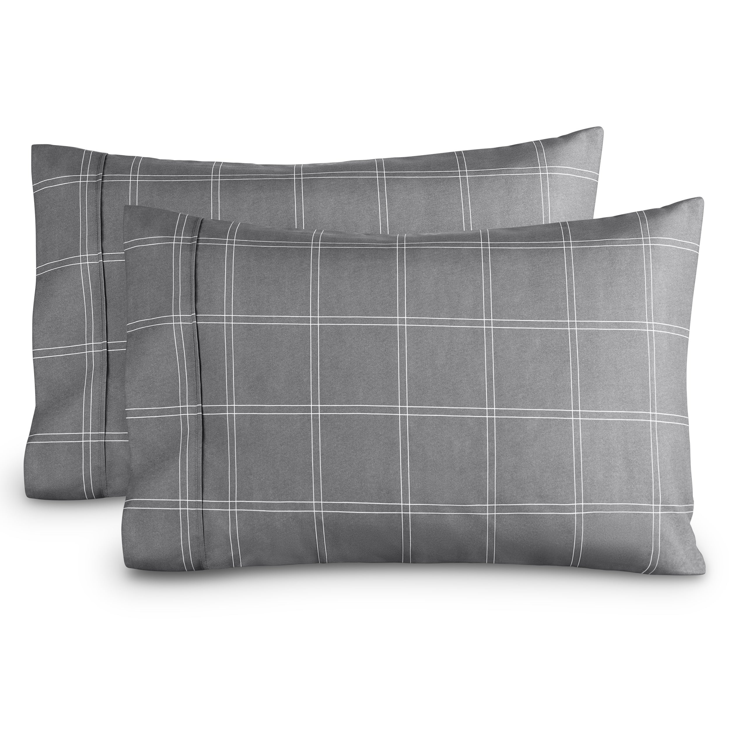 Two pillowcases on a white background with print pillowcases on them.