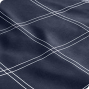Close up view of the corner of a mattress with the microfiber fitted sheet to show how it fits. 