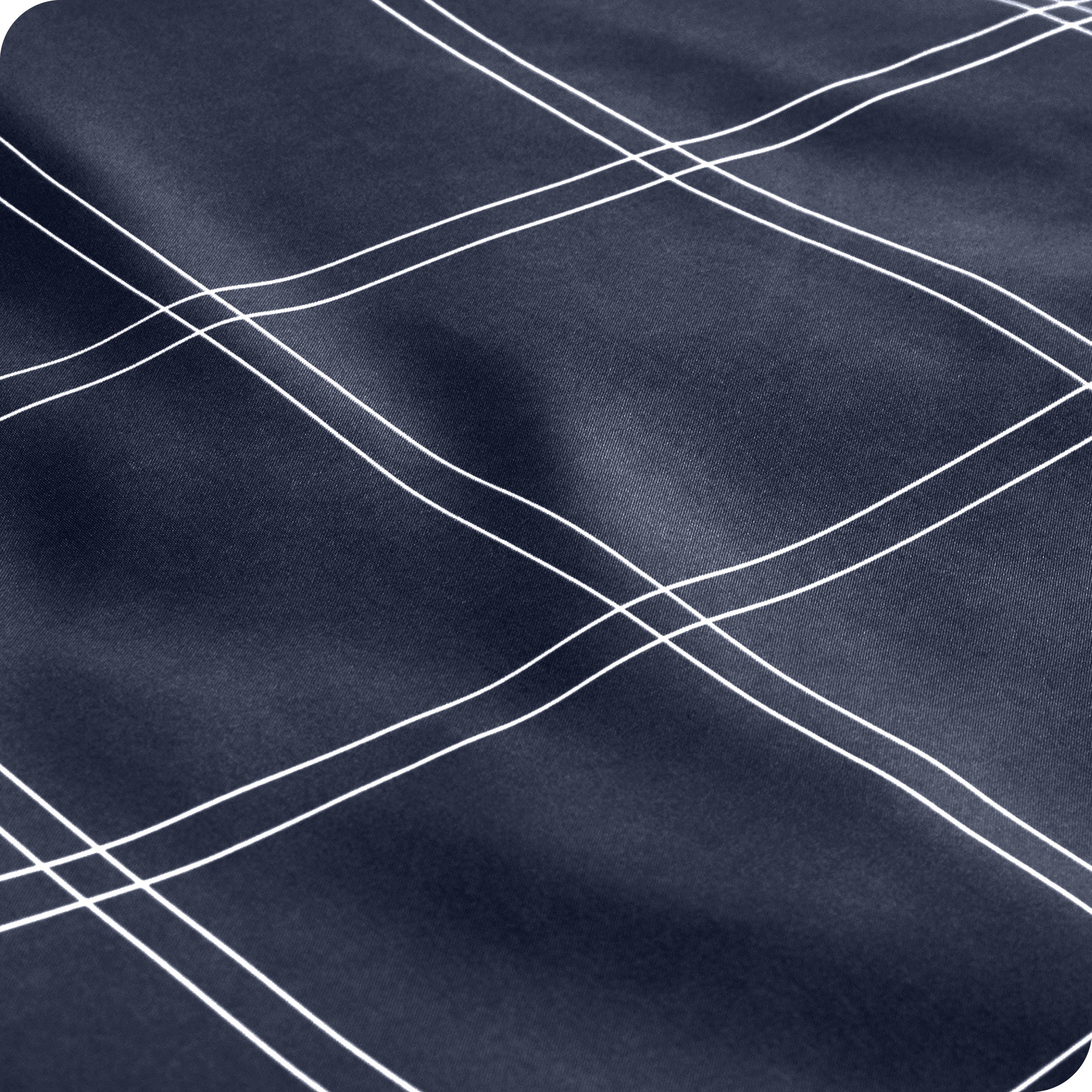 Close up view of the corner of a mattress with the microfiber fitted sheet to show how it fits. 