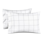 Two pillowcases on a white background with print pillowcases on them.