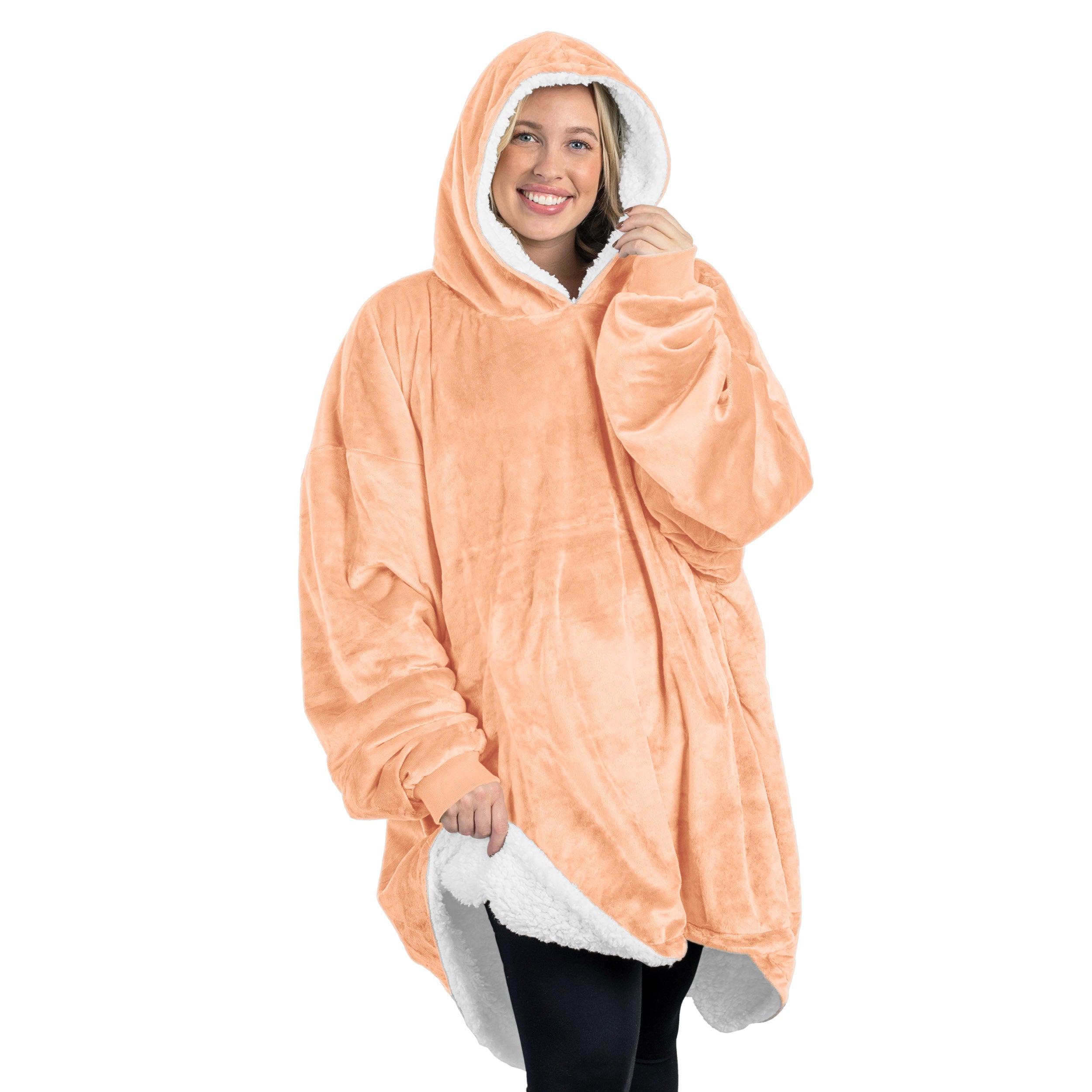 An adult with a sherpa wearable blanket on