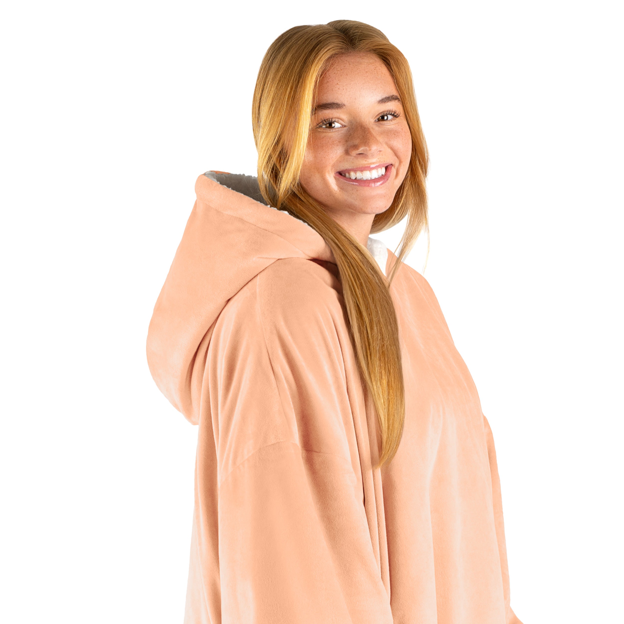 An adult with a hooded wearable blanket on