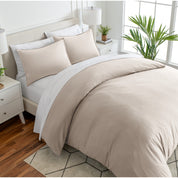 Angled view of bed with a duvet cover folded over on itself