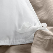 Close up of cloth ties for attaching duvet insert to inside of duvet cover