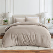 Relaxing room scene with a duvet cover laid out over the bed