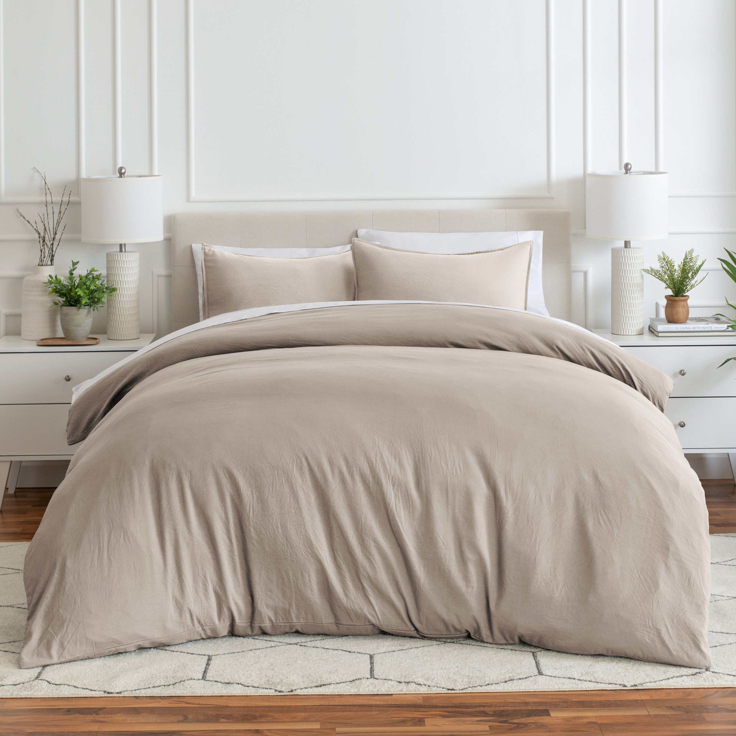 Relaxing room scene with a duvet cover laid out over the bed