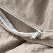 Close up of the zipper on the duvet cover partially opened