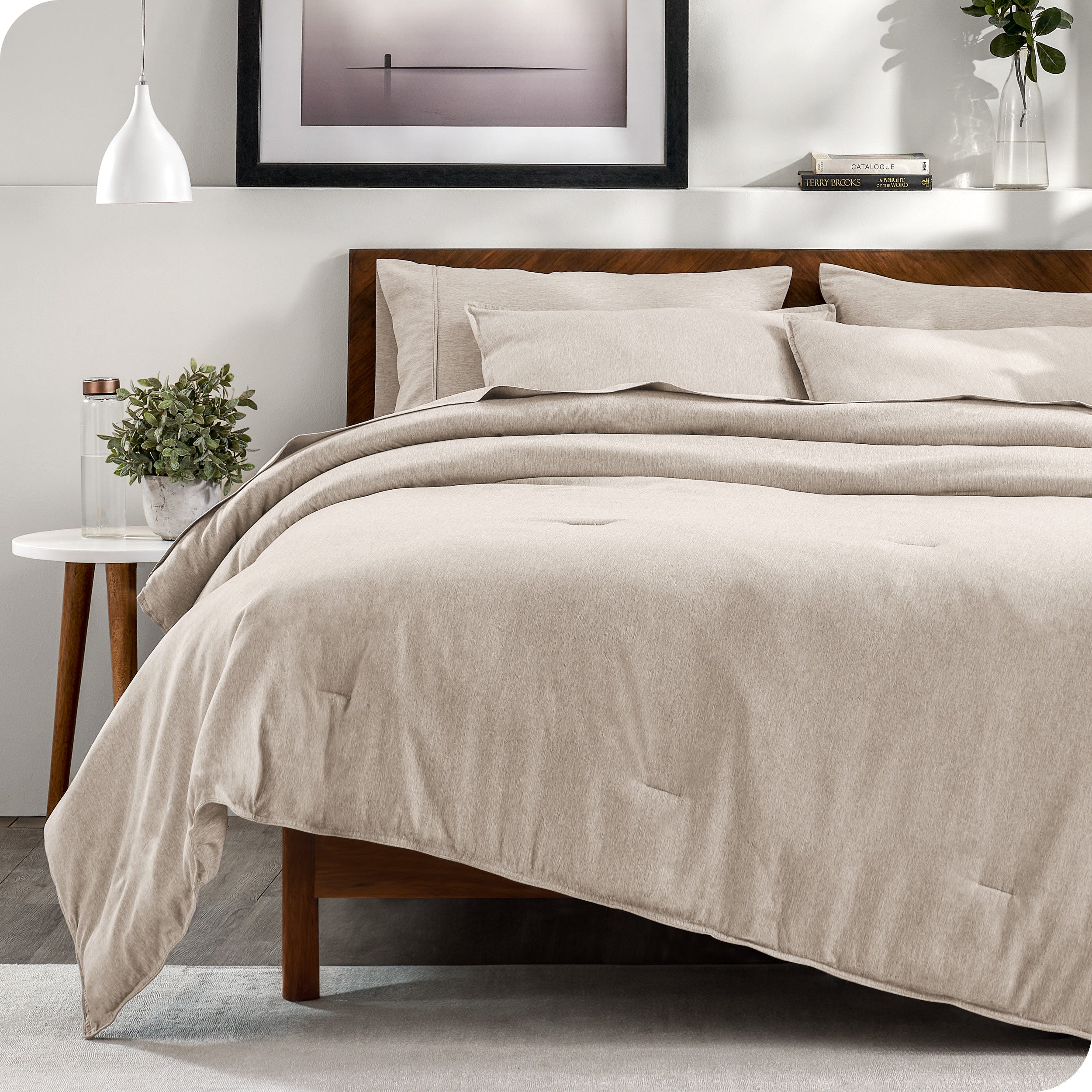 A bedding set on a bed in a modern bedroom