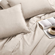 Close of matching sheets, comforter, pillowcases and pillow shams on a bed