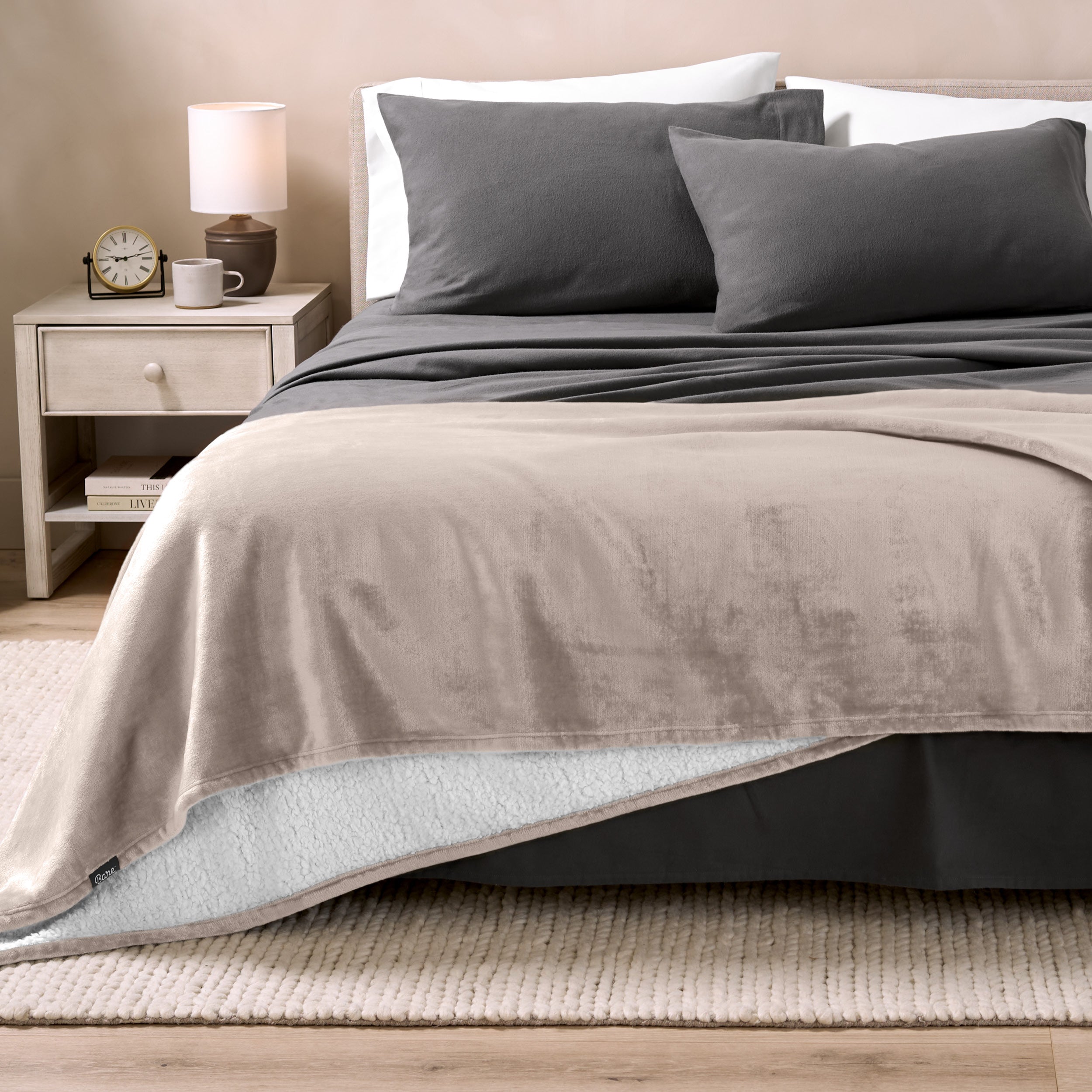 Sherpa Blanket laying on a bed folded over itself part way