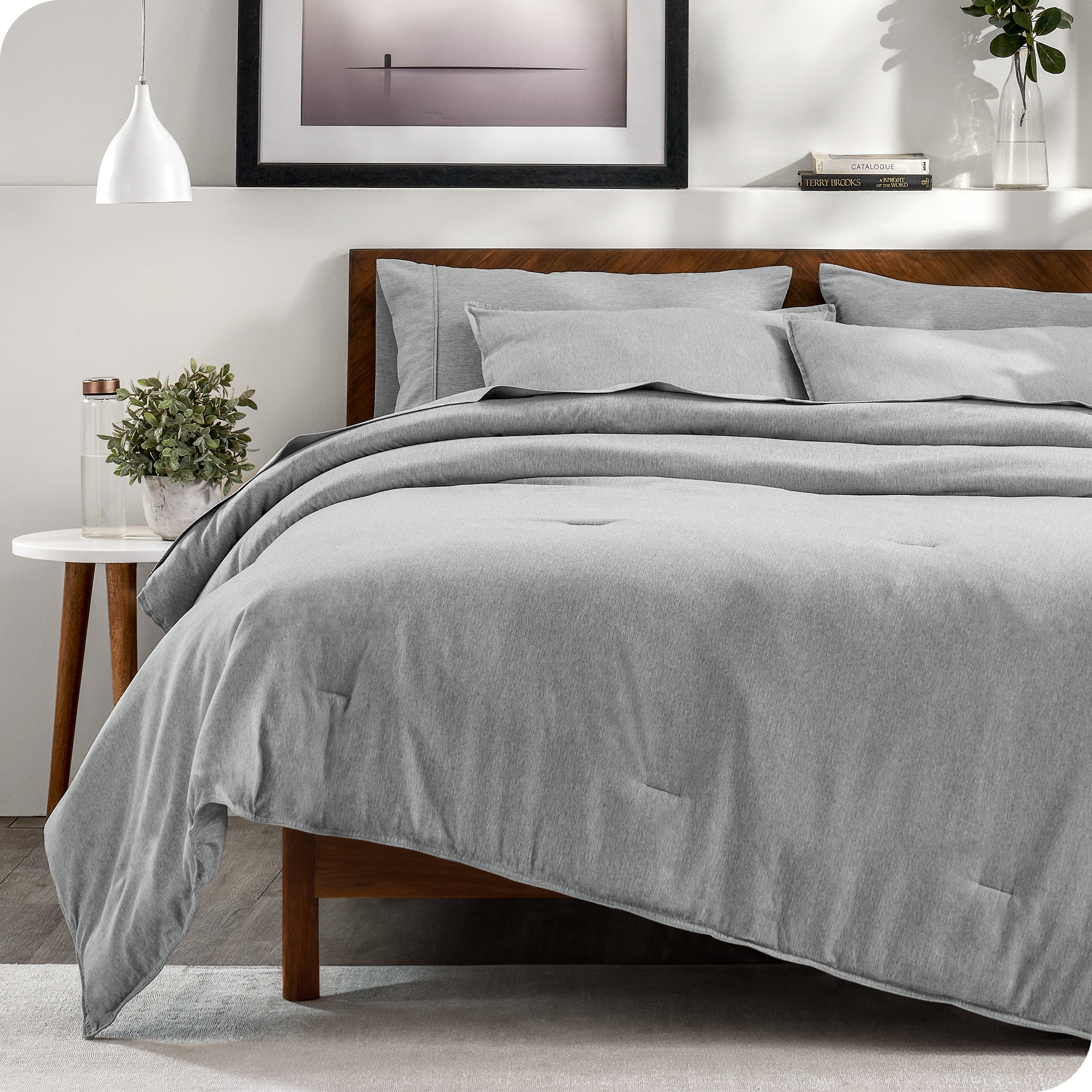 A bedding set on a bed in a modern bedroom