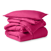 A microfiber comforter folded neatly with a pillow from above