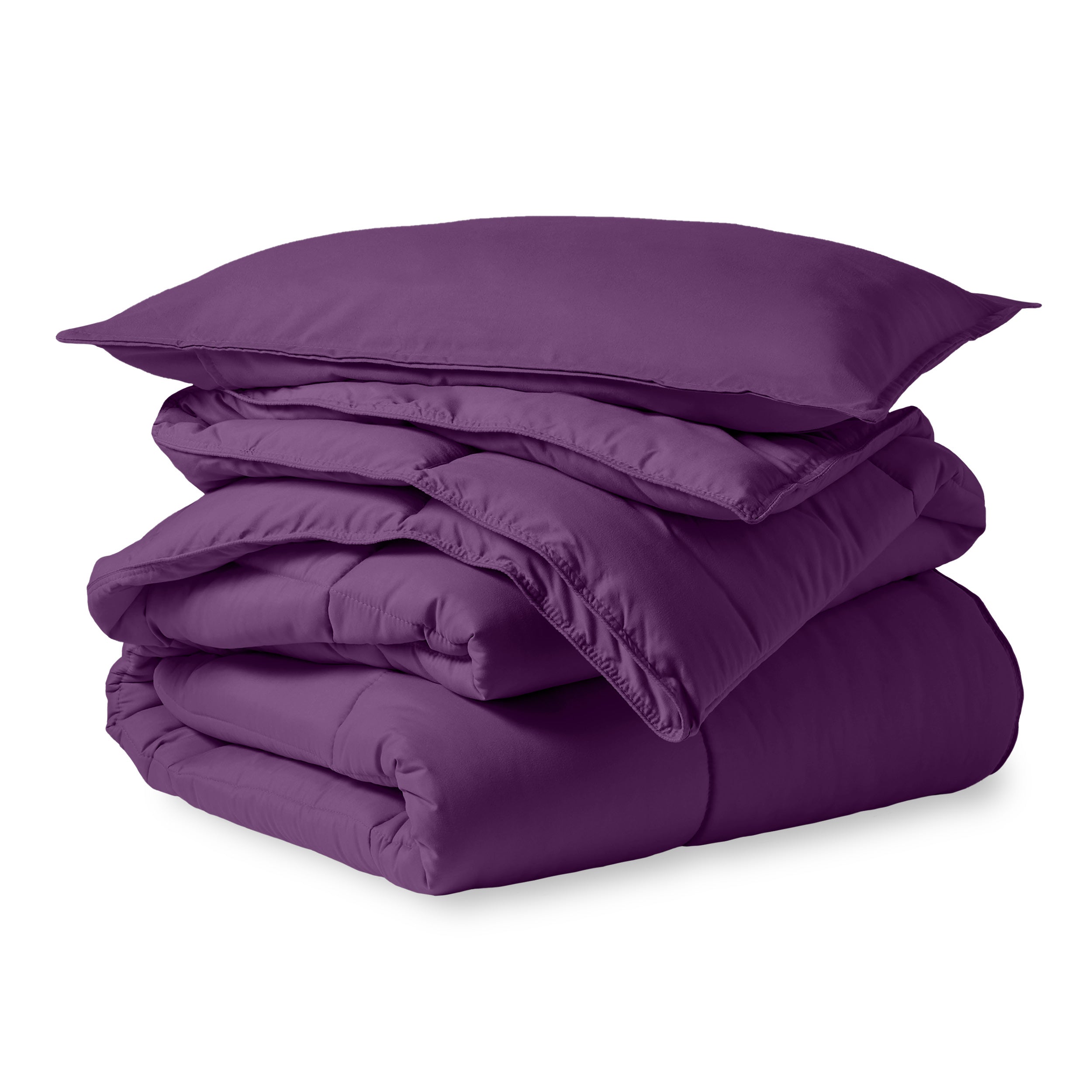 A microfiber comforter folded neatly with a pillow from above