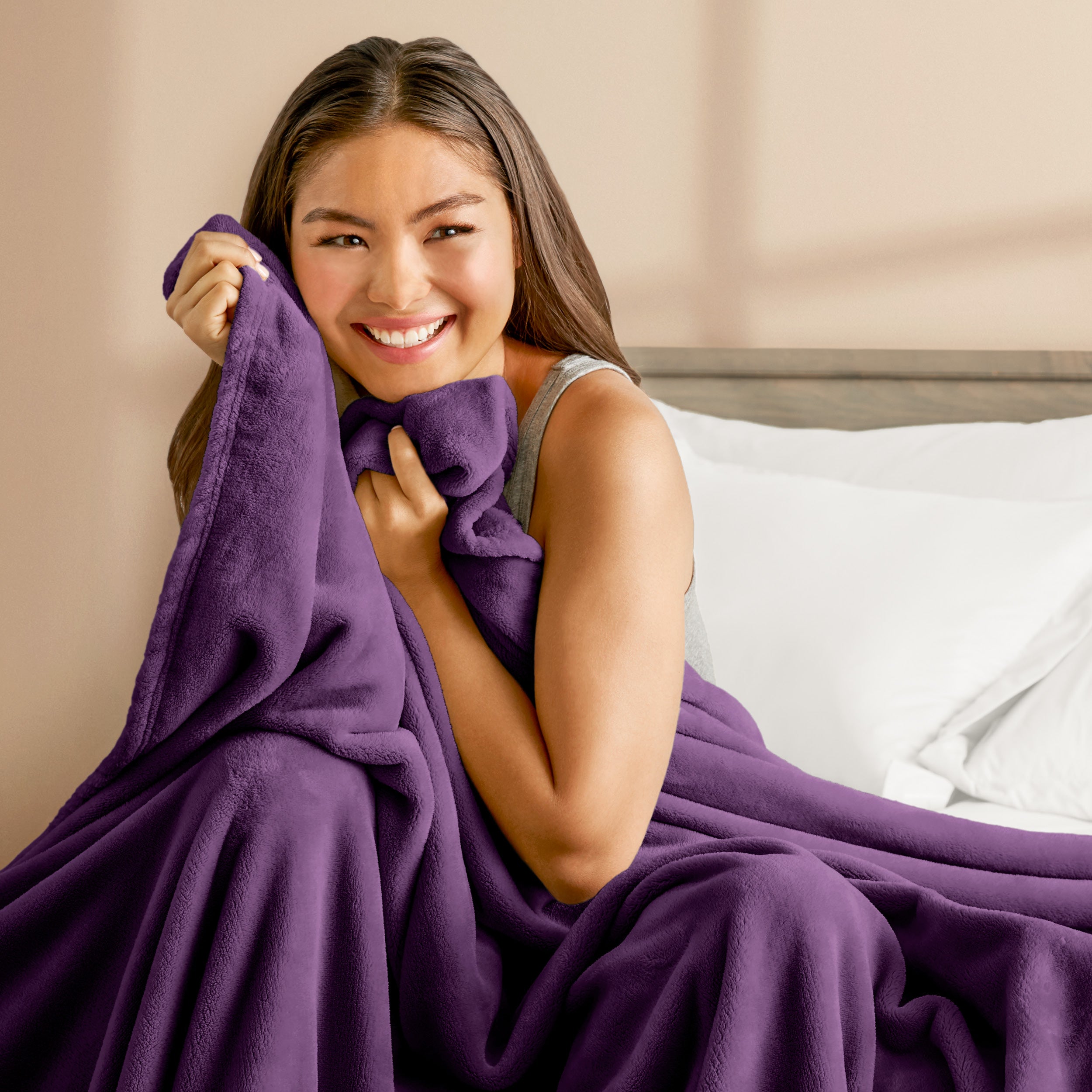 Microplush blanket laid out over a bed and folded back over itself