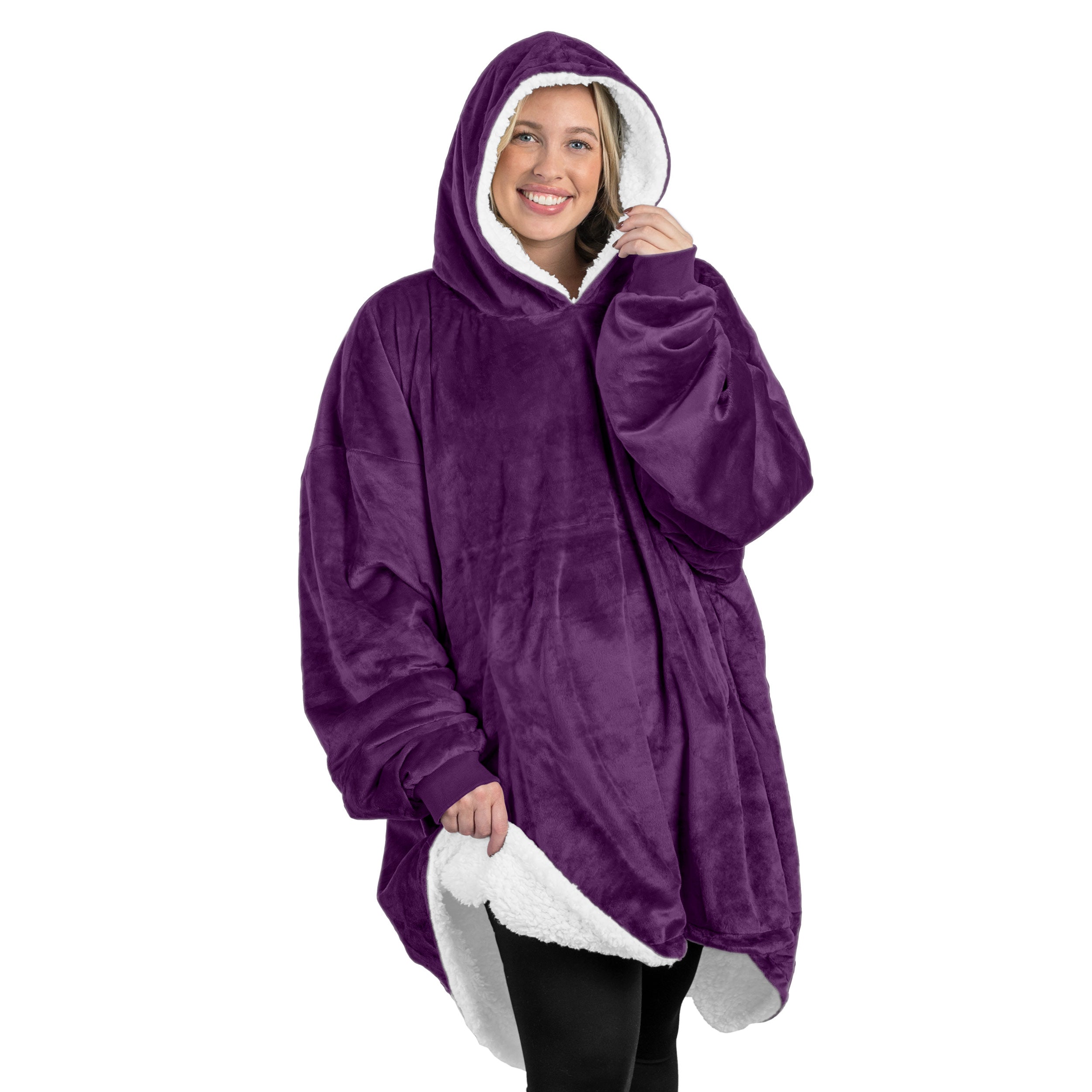 An adult with a sherpa wearable blanket on
