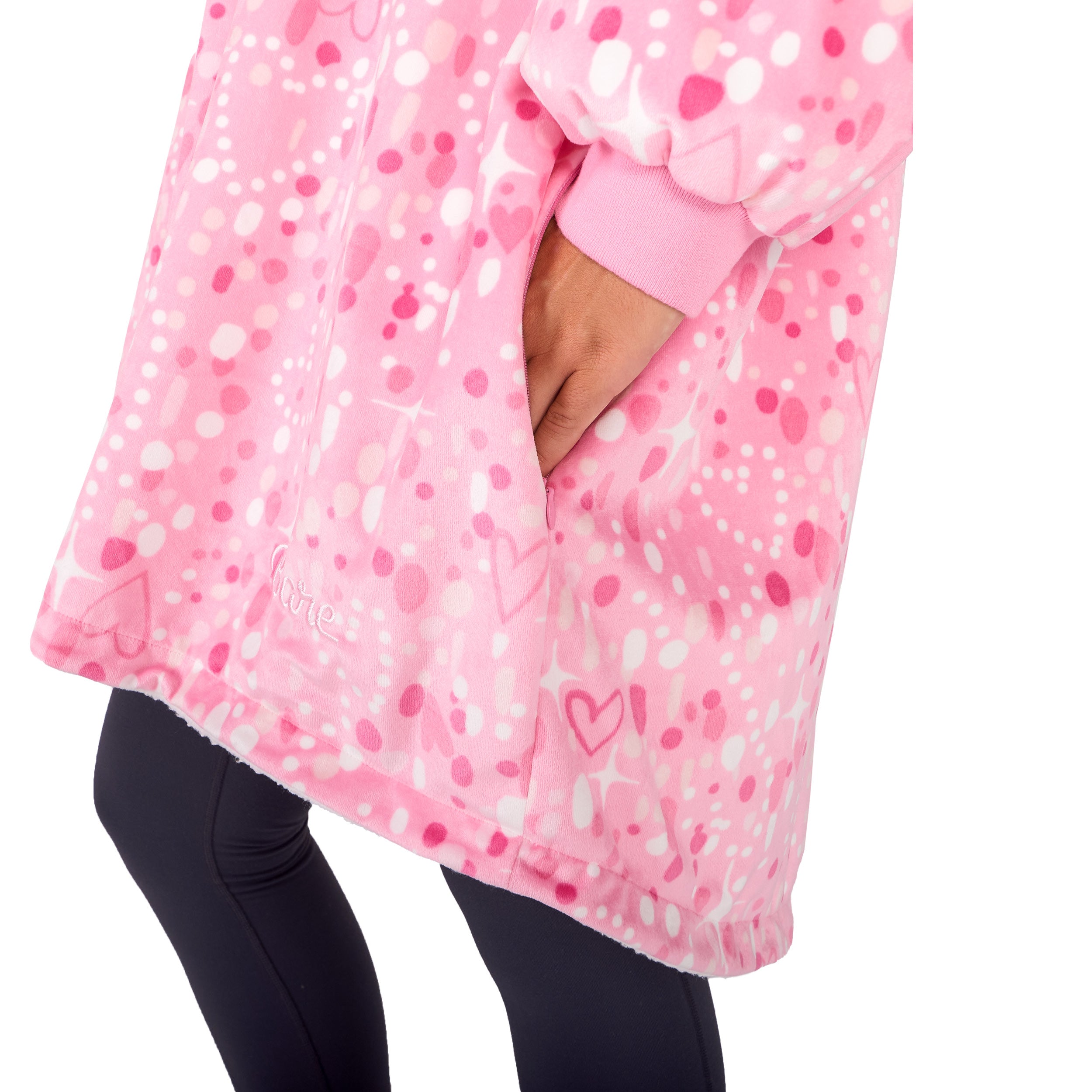 An adult with a hooded wearable blanket on