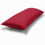 A body pillow cover on a pillow on a plain white background