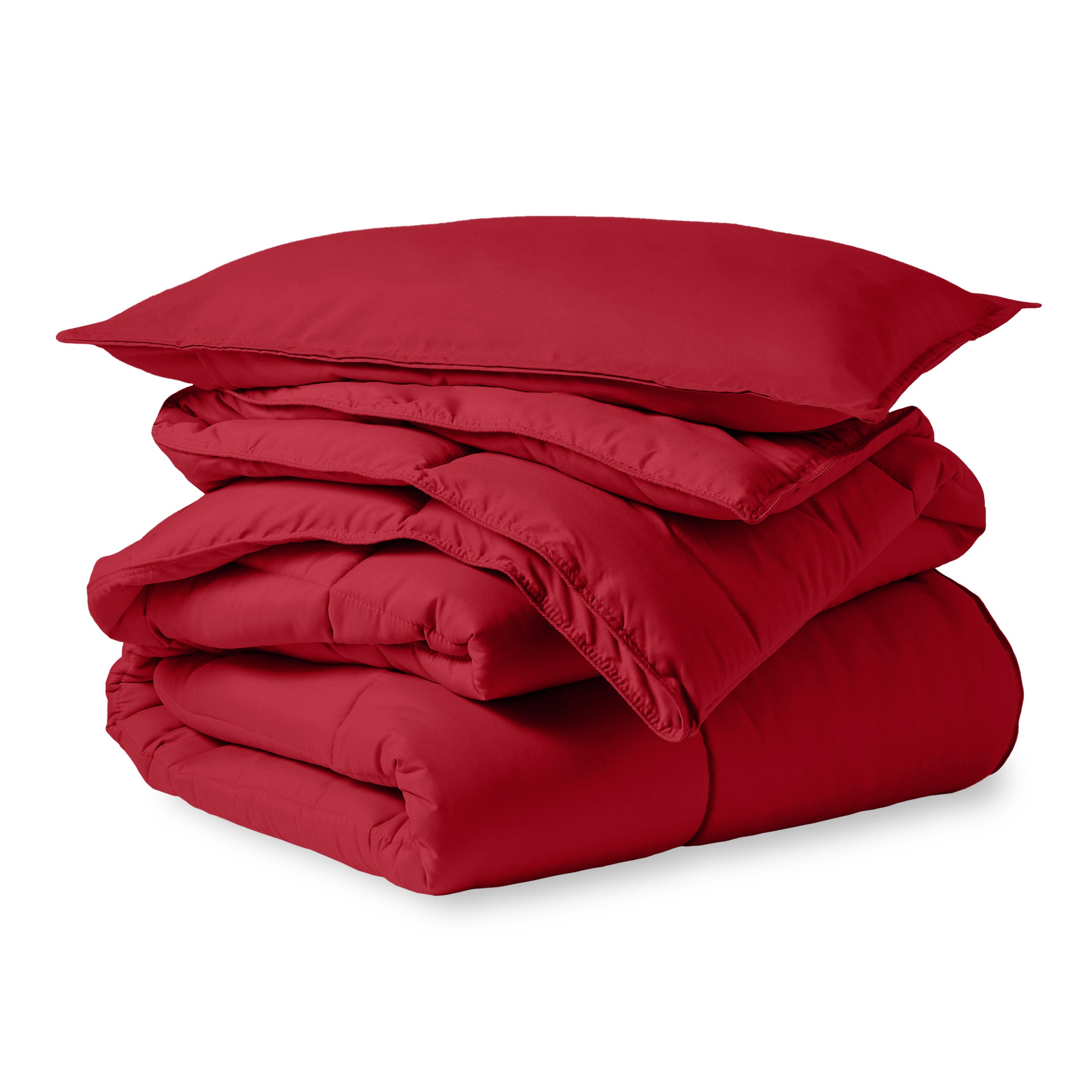 A microfiber comforter folded neatly with a pillow from above