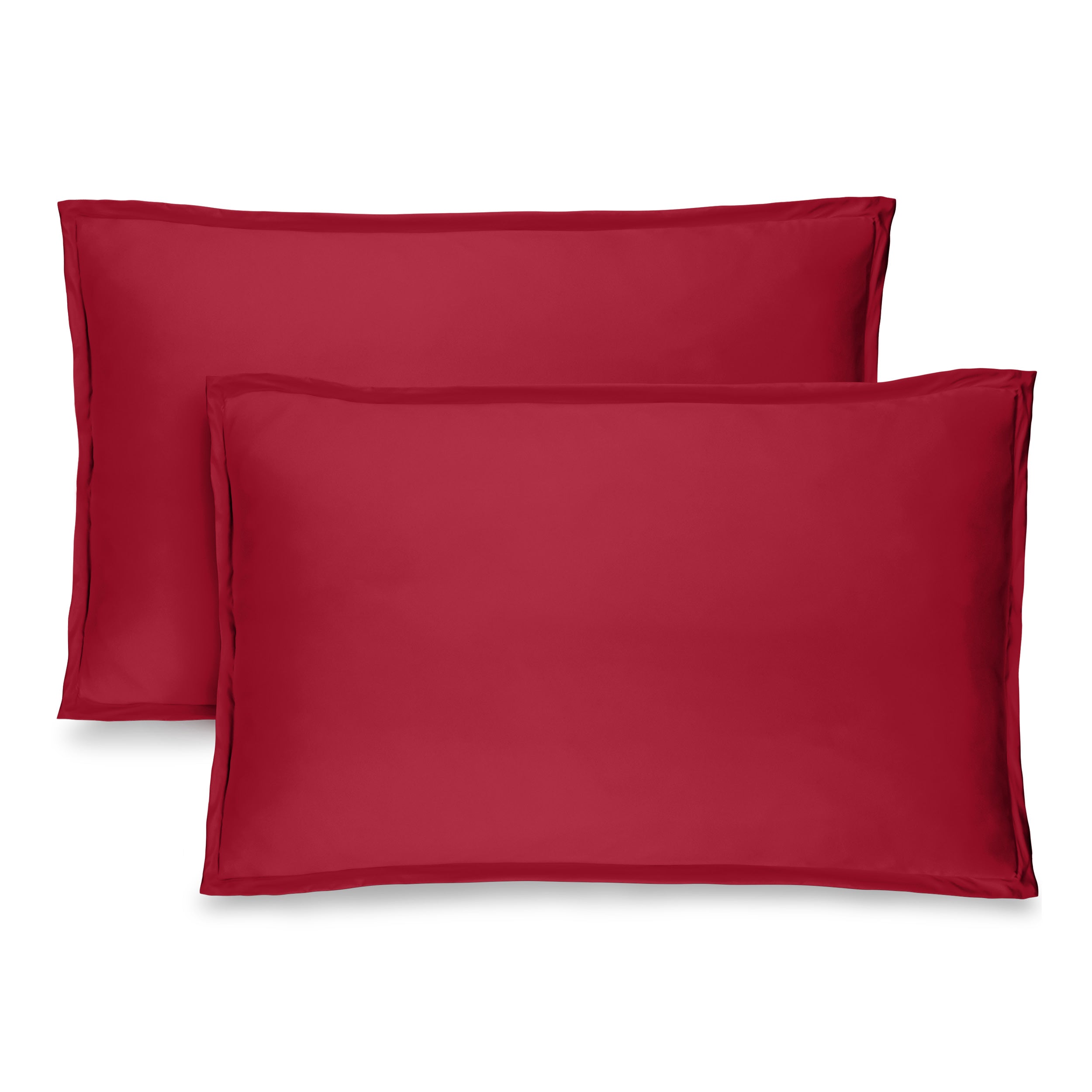 Two pillow shams on pillows standing up with one behind the other
