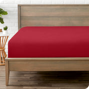 End of bed view with fitted sheet made on the mattress of a modern bed. 