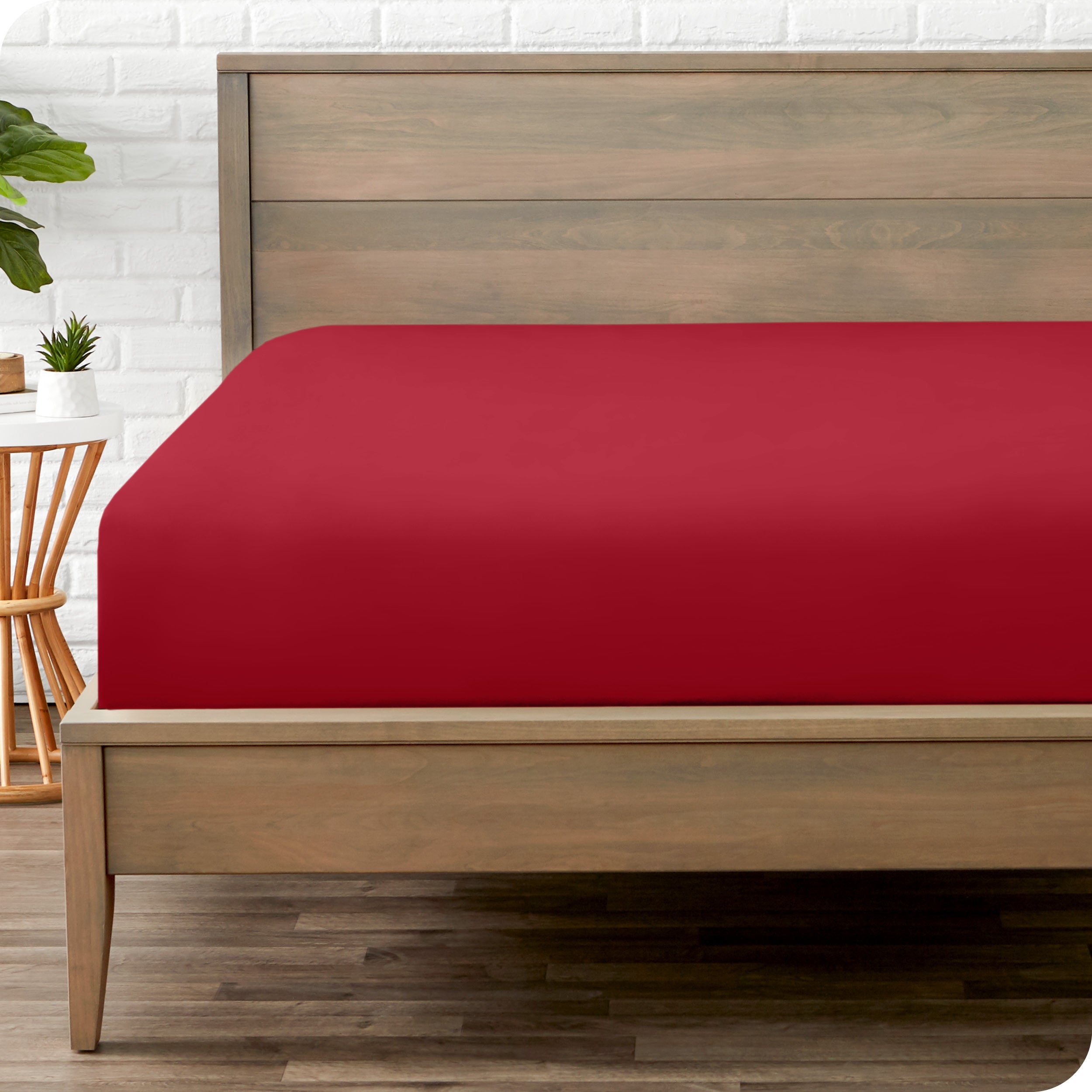 End of bed view with fitted sheet made on the mattress of a modern bed. 