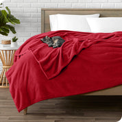 Microplush blanket laid out over a bed and folded back over itself