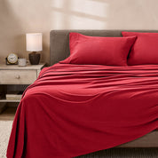 View of fleece sheets from the end of a bed with the top sheet draped over the side and end