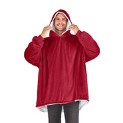 An adult with a sherpa wearable blanket on