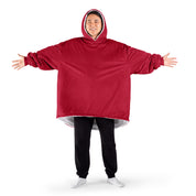 An adult with a sherpa wearable blanket on