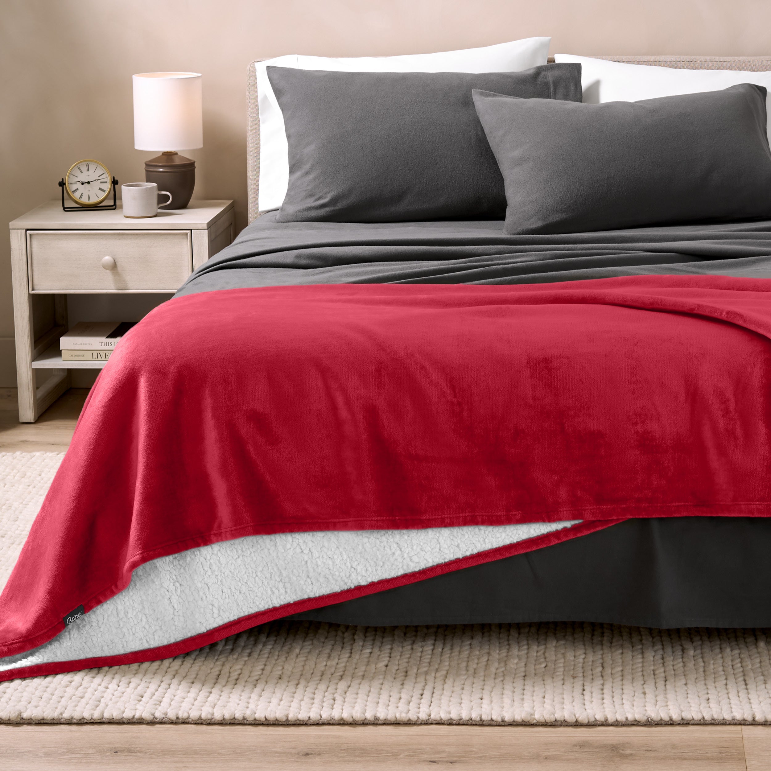 Sherpa Blanket laying on a bed folded over itself part way