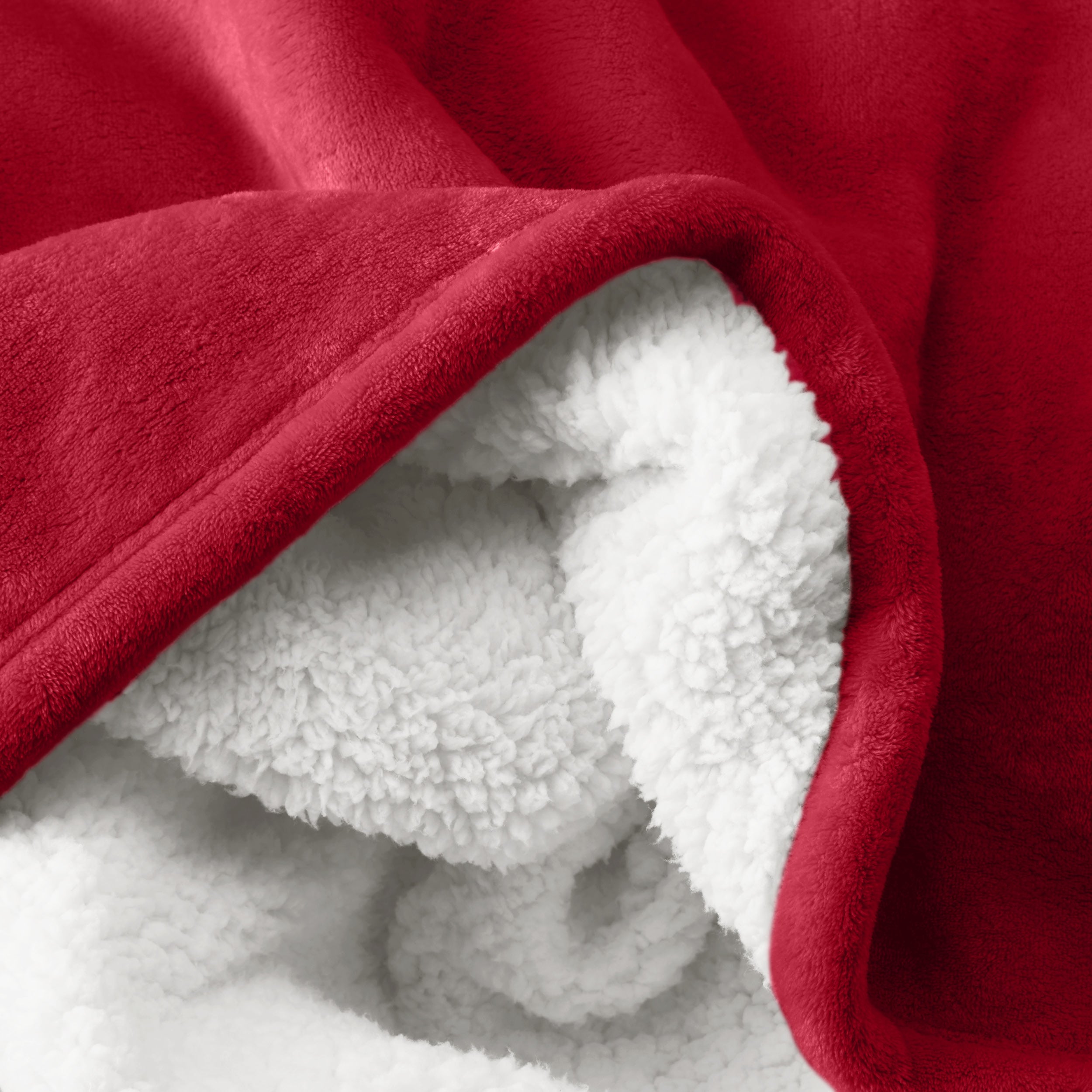 Close up of sherpa blanket showing texture of velvety soft side and sherpa backing