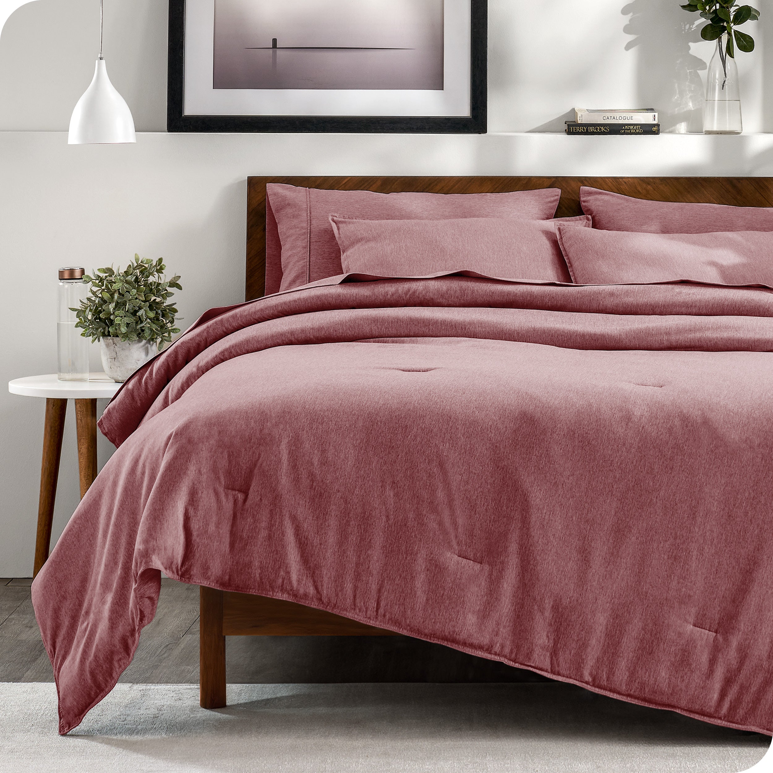 A bedding set on a bed in a modern bedroom