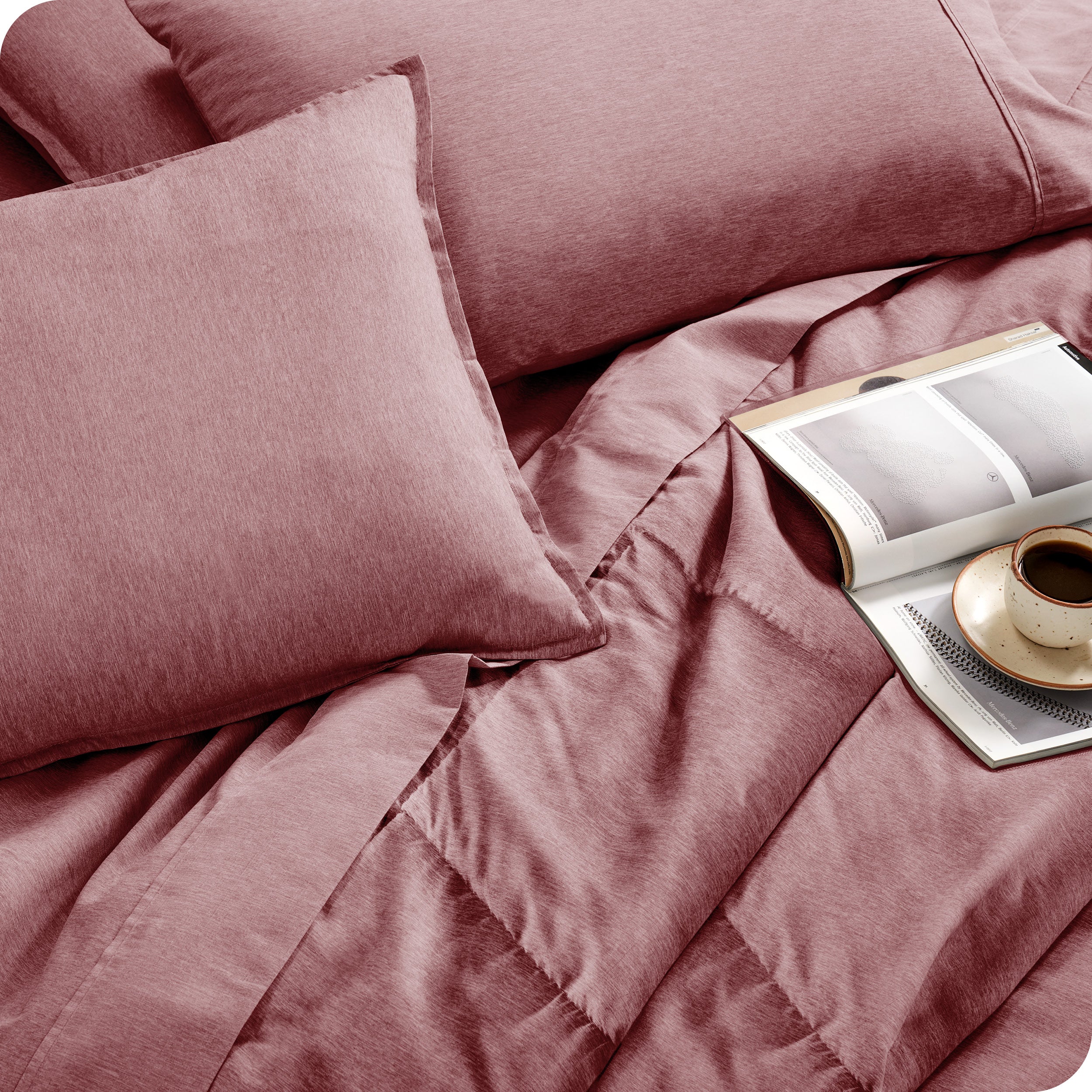 Close of matching sheets, comforter, pillowcases and pillow shams on a bed