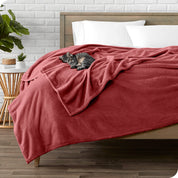 Microplush blanket laid out over a bed and folded back over itself