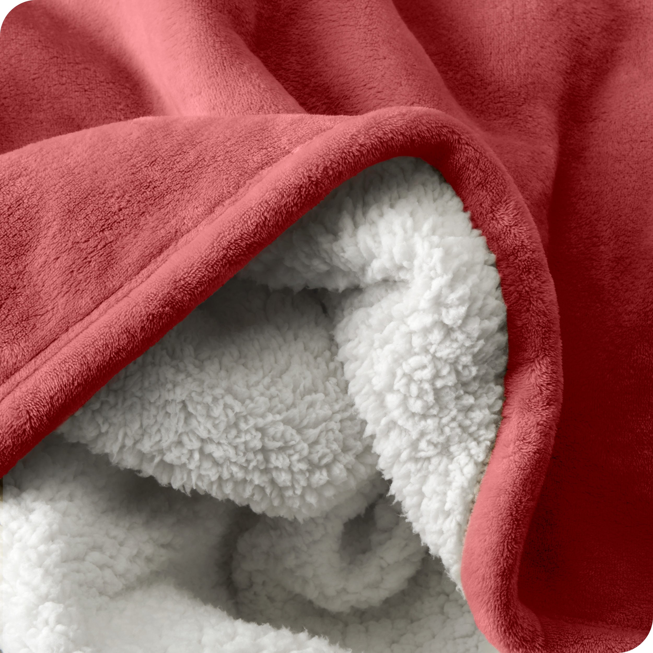 Close up of sherpa blanket showing texture of velvety soft side and sherpa backing