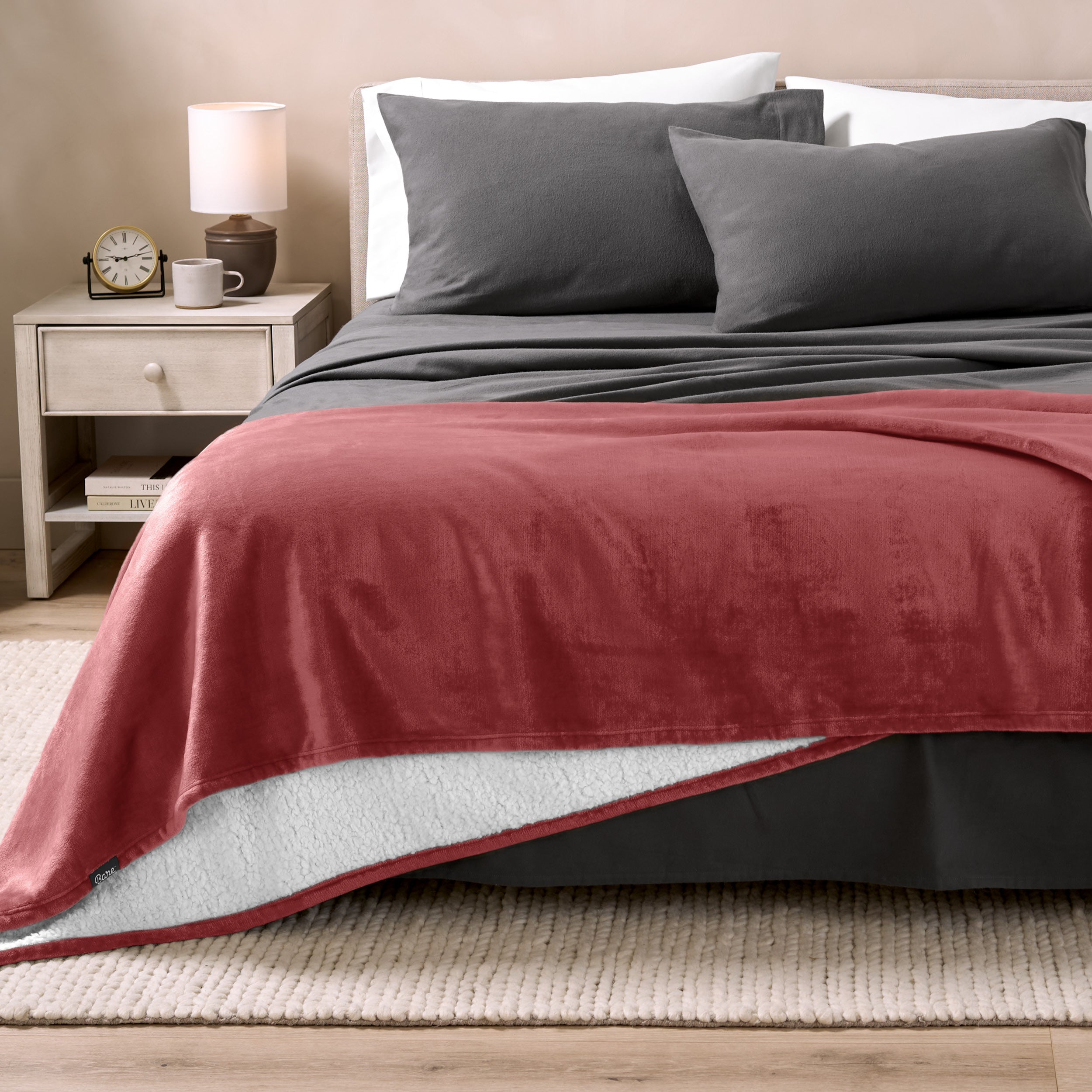 Sherpa Blanket laying on a bed folded over itself part way